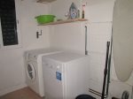 Laundry room with vacuum, washer, dryer, mop, pail, iron and board